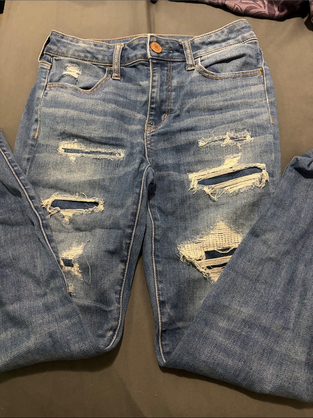 Women’s Distressed Mid Blue Jeans